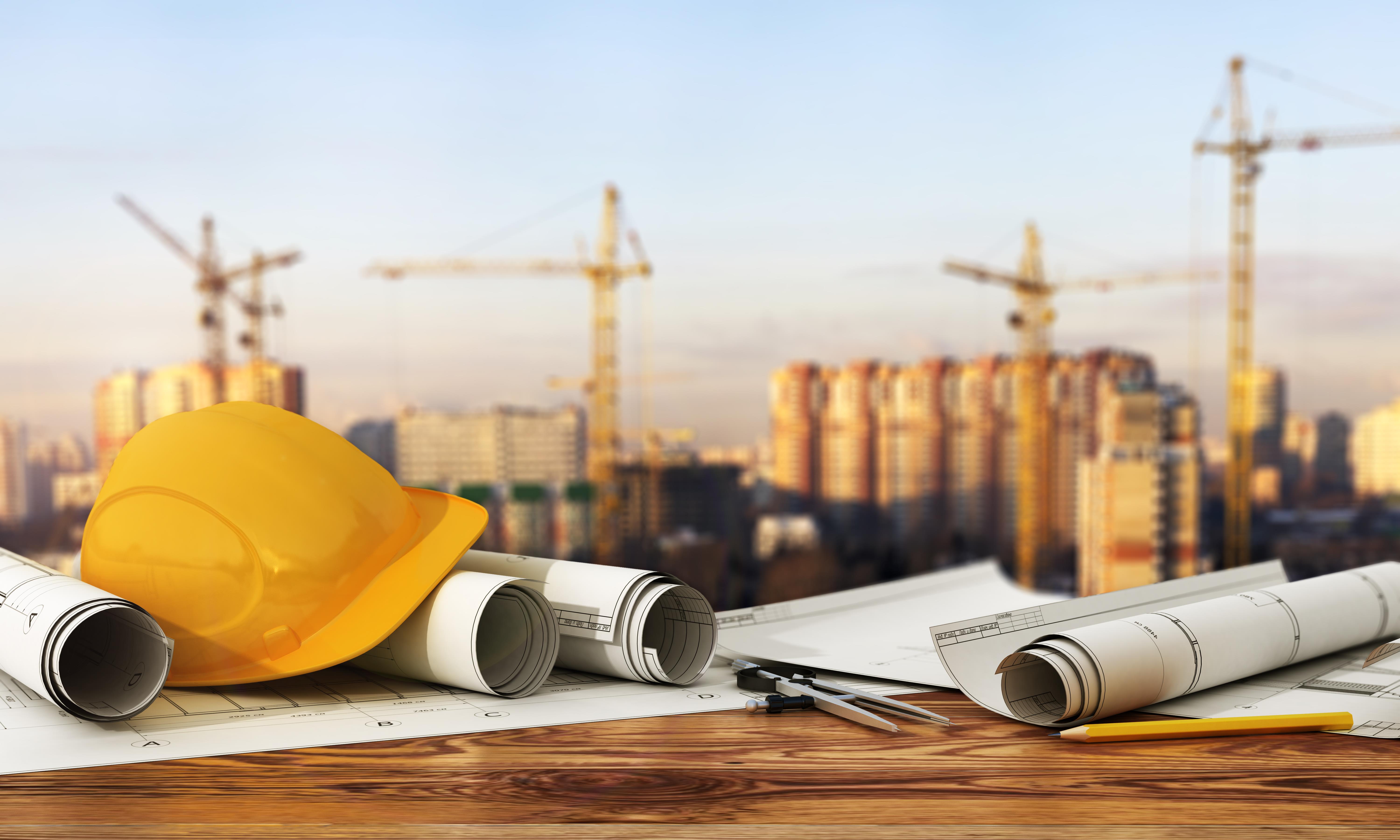 2269 Concept of construction and design. 3d render of blueprints and designer tools on the panorama of construction site. SAN 02170