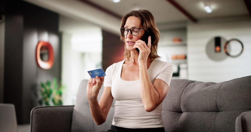 4076 mp68057556 senior woman receives scam call about pension fraud