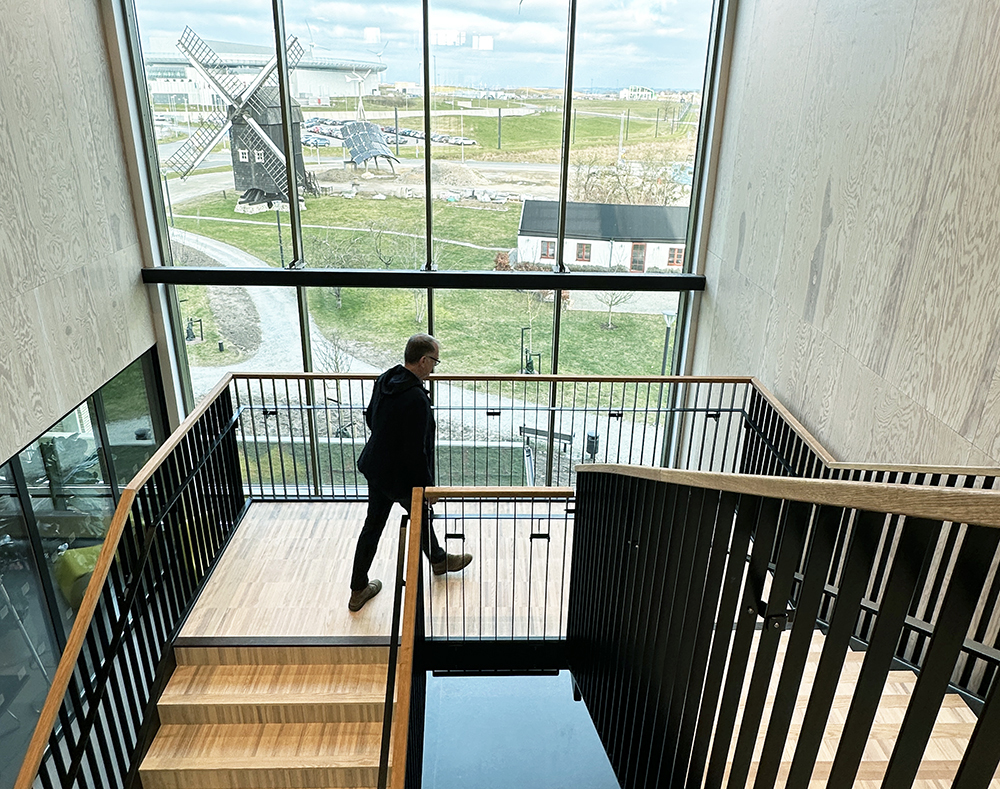 Photo of a man walking up the stairs.