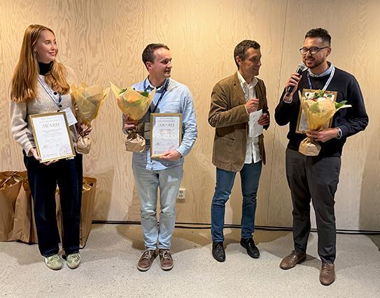 Photo of people at an award ceremony.