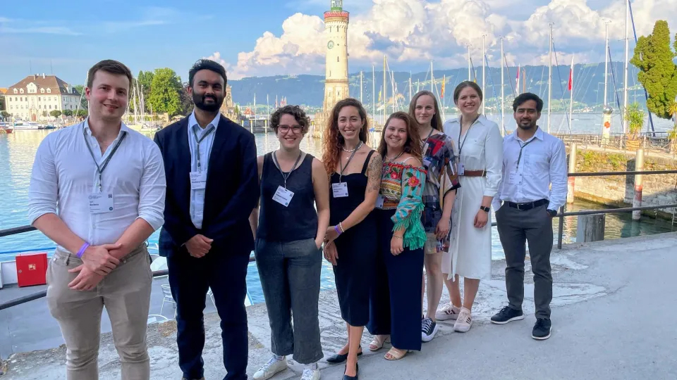 Photo of a group of people standing outside.