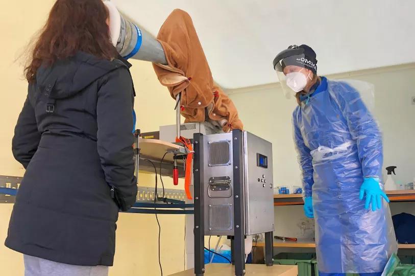 Photo of two people conducting a scientific experiment.