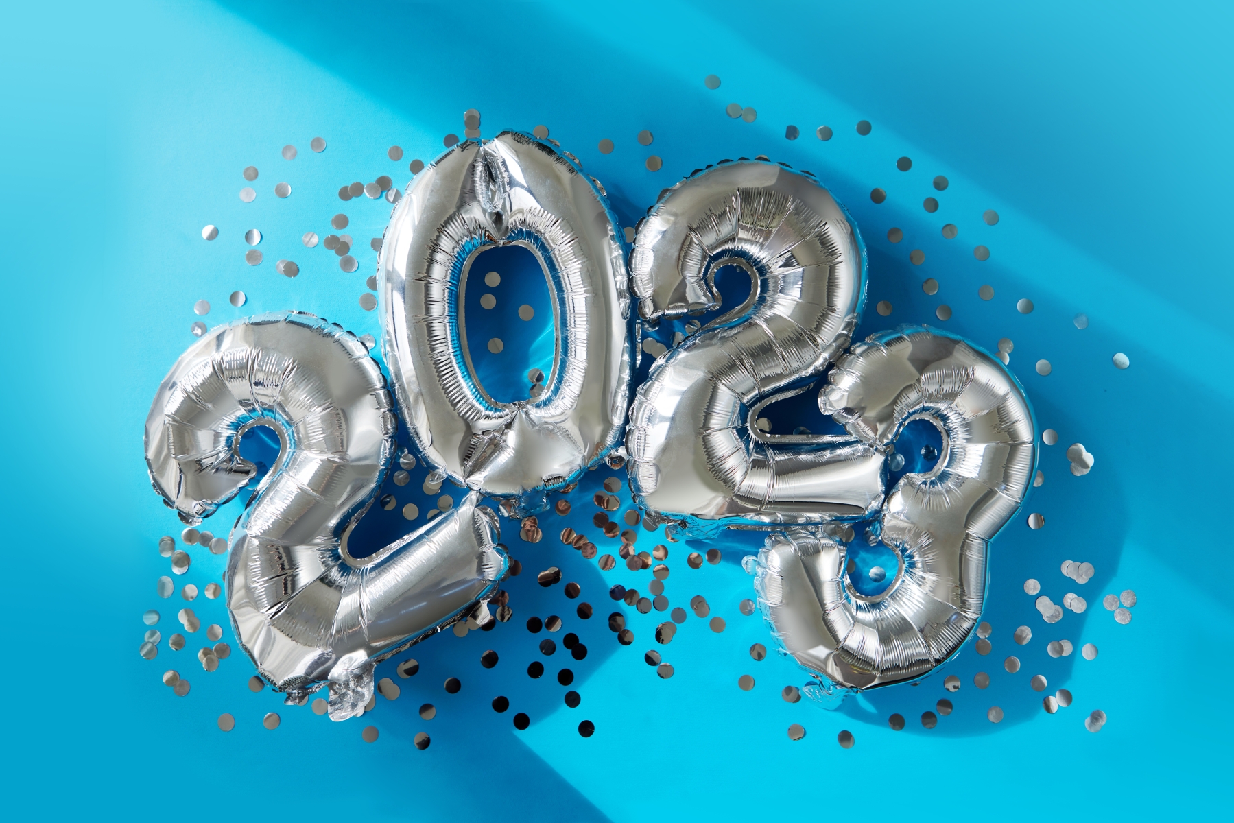 1048 55684257 silver numbers 2023 new year balloons in sunlight blue