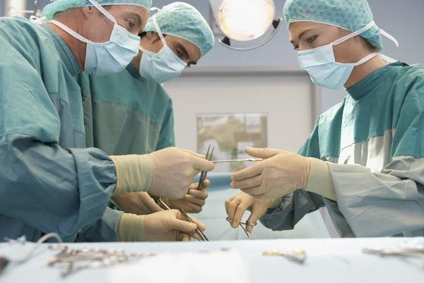 Surgeons operating on a patient