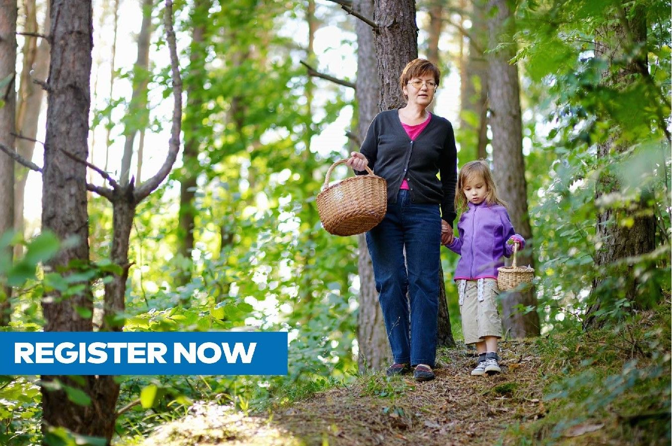 Grandmom walking in forest with a little girl